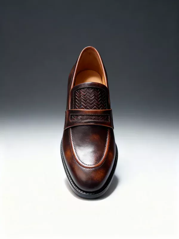 Men's brown handcrafted leather loafers with woven saddle by Royal Moccs.