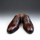 Men's brown handcrafted leather loafers with woven saddle by Royal Moccs.