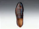 Men's brown handcrafted leather loafers with woven saddle by Royal Moccs.