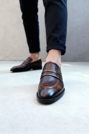 Men's brown handcrafted leather loafers with woven saddle by Royal Moccs.