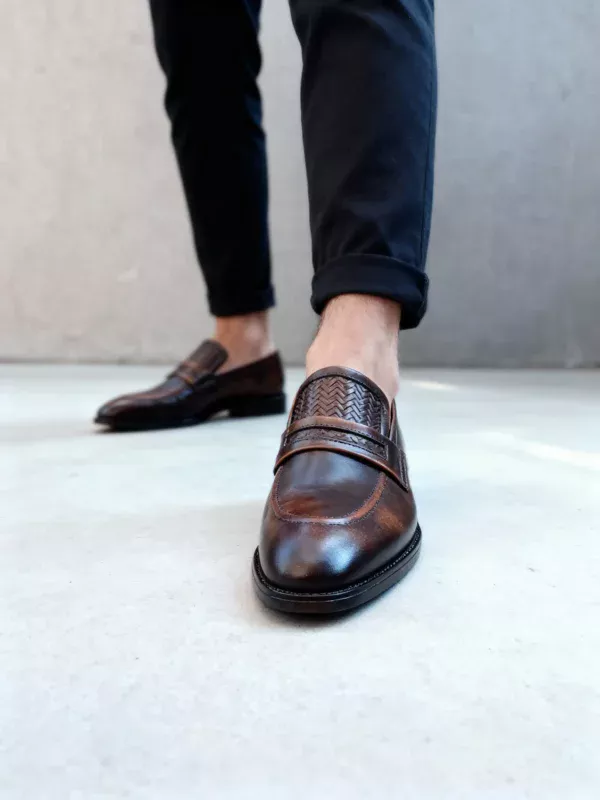 Men's brown handcrafted leather loafers with woven saddle by Royal Moccs.